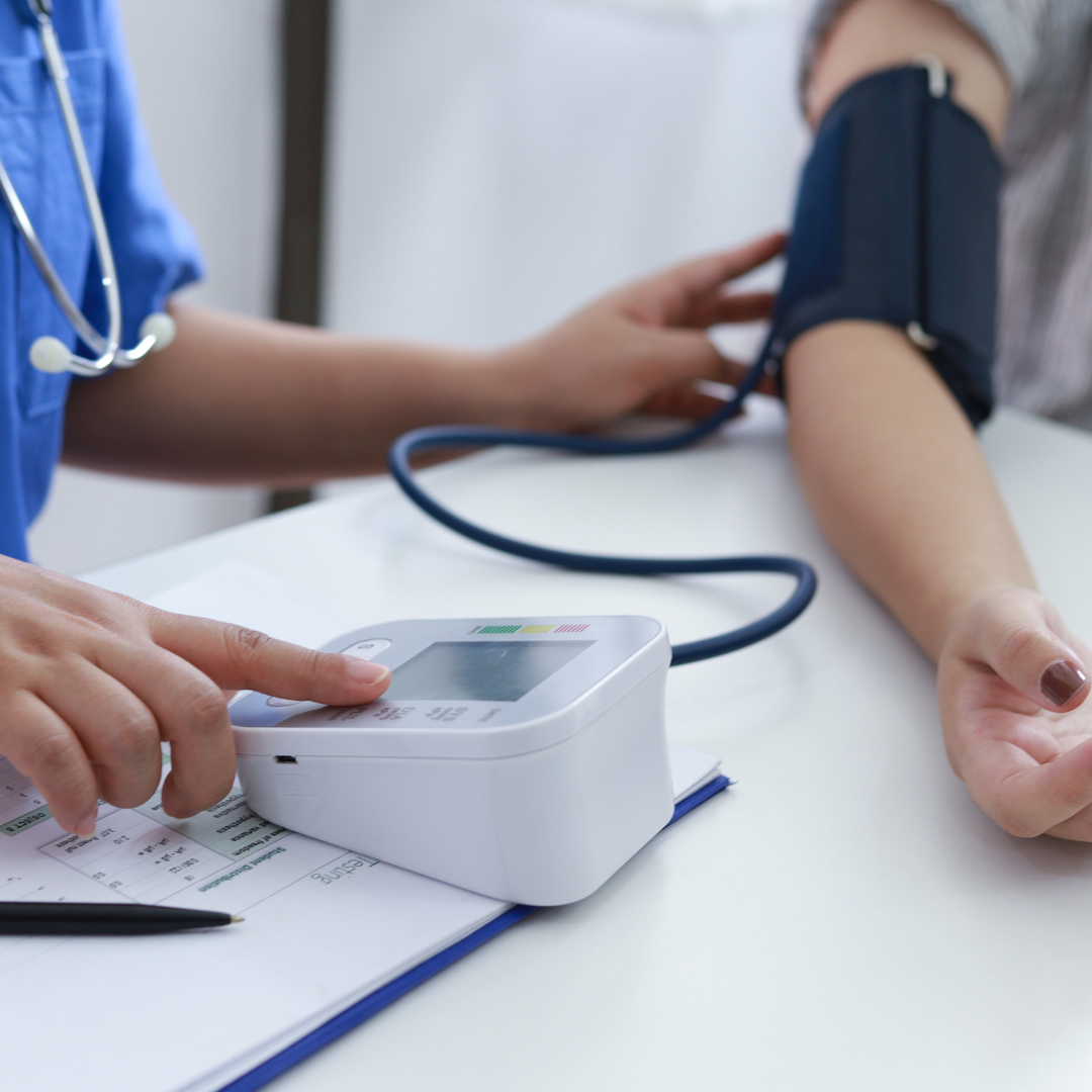 Clinician checking the blood pressure of the client