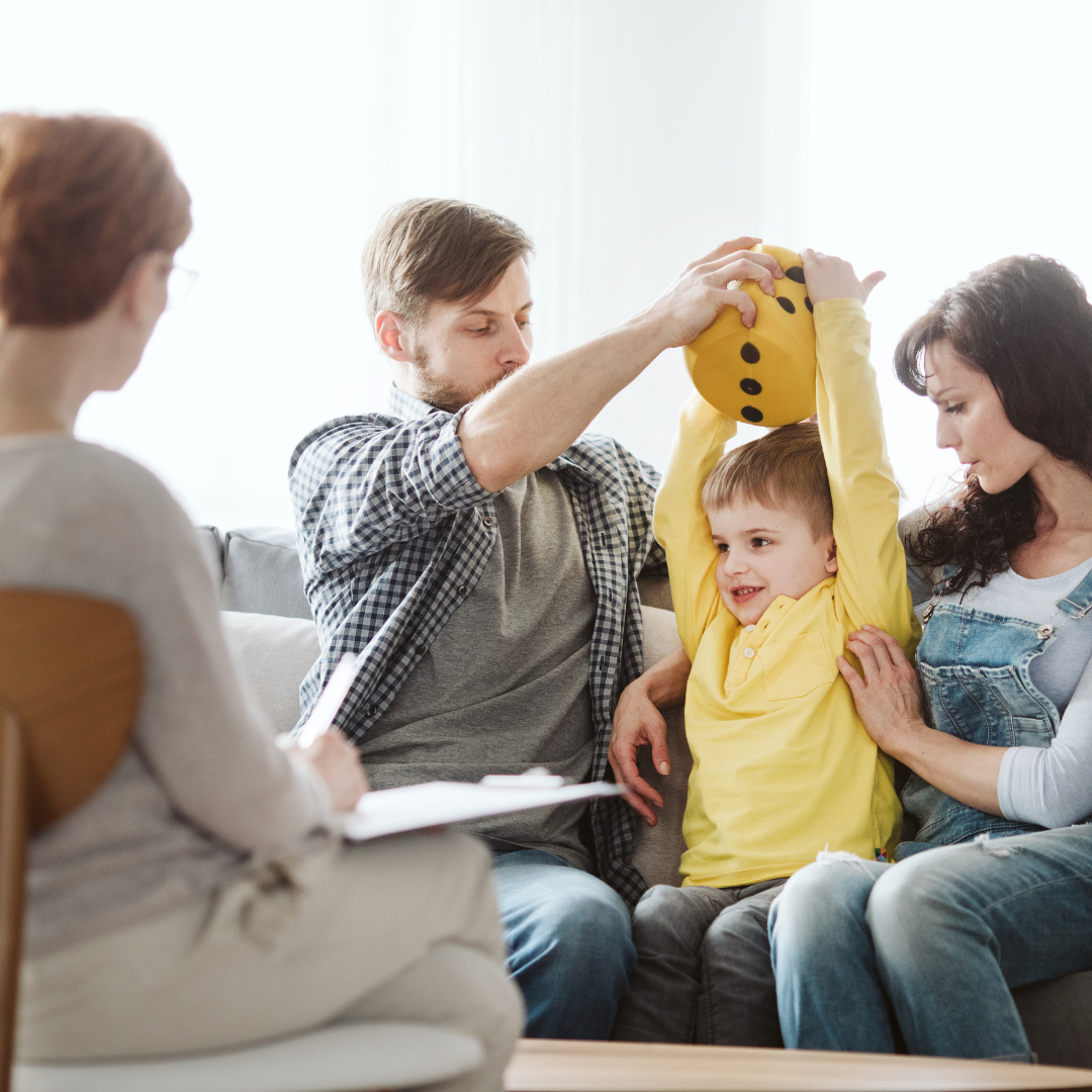 Parents with one kid talking to an expert about ADHD