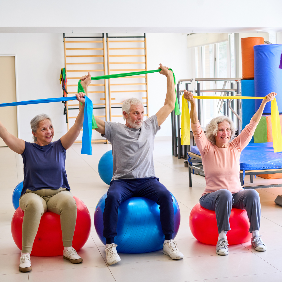 Small group heart health exercise class using resistance bands at One Wellness Center in Greensboro